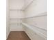 Bright walk-in closet provides custom wire shelving for optimal storage and organization at 4583 Grenadine Cir, Acworth, GA 30101