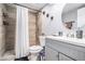 Bathroom features tiled shower with white shower curtain, brushed metal fixtures, and updated vanity at 46 Le Parc Fontaine, Lithonia, GA 30038