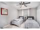 Bright bedroom featuring twin beds, ceiling fan, and natural light, perfect for a comfortable and inviting space at 46 Le Parc Fontaine, Lithonia, GA 30038