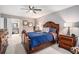 Large bedroom with ceiling fan and bright light, showcasing a well-made bed and matching bedside tables at 46 Le Parc Fontaine, Lithonia, GA 30038