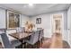 Elegant dining room with seating for six, hardwood floors, and contemporary decor at 46 Le Parc Fontaine, Lithonia, GA 30038