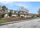 Inviting two-story condo complex with landscaped front and traditional architecture at 46 Le Parc Fontaine, Lithonia, GA 30038