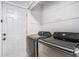 Functional laundry room with modern stainless steel washer and dryer, offering convenience and efficiency at 46 Le Parc Fontaine, Lithonia, GA 30038