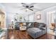 Comfortable living room with recessed lighting, ceiling fan, plush grey sofa and hardwood floors at 46 Le Parc Fontaine, Lithonia, GA 30038