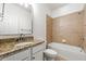 Cozy bathroom with a tub, granite countertop, and a vanity at 5534 Parkerton Ln, Atlanta, GA 30342