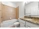 Cozy bathroom with a tub, granite countertop, and a vanity at 5534 Parkerton Ln, Atlanta, GA 30342