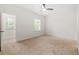 Bright bedroom with neutral carpet and windows for natural light at 5534 Parkerton Ln, Atlanta, GA 30342