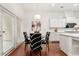 Eat-in kitchen dining area with hardwood floors, white cabinets, and access to the outdoors at 5534 Parkerton Ln, Atlanta, GA 30342