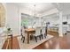 Elegant dining area featuring hardwood floors, modern lighting, and an open layout at 5534 Parkerton Ln, Atlanta, GA 30342