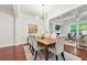 Sunlit dining room featuring a modern chandelier and wood table at 5534 Parkerton Ln, Atlanta, GA 30342