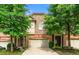 Charming townhome with a brick and stone exterior and well-maintained landscaping at 5534 Parkerton Ln, Atlanta, GA 30342