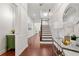 Inviting foyer with hardwood floors, white walls, staircase, and stylish decor at 5534 Parkerton Ln, Atlanta, GA 30342