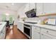 Modern kitchen with white cabinets, countertops, stainless appliances, and stylish backsplash at 5534 Parkerton Ln, Atlanta, GA 30342