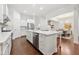 Open kitchen with white cabinets, marble countertops, and stainless steel appliances at 5534 Parkerton Ln, Atlanta, GA 30342