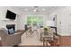 Cozy living room with a fireplace, coffered ceilings, and bright windows at 5534 Parkerton Ln, Atlanta, GA 30342
