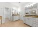 Main bathroom with granite countertops, double vanity and tile flooring at 5534 Parkerton Ln, Atlanta, GA 30342
