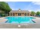 Community pool with sun loungers surrounded by lush greenery, perfect for relaxation at 5534 Parkerton Ln, Atlanta, GA 30342