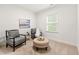 Cozy sitting room with stylish chairs, ottoman and natural light at 5534 Parkerton Ln, Atlanta, GA 30342