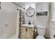 Bathroom with tile walls, modern vanity and round mirror at 1083 Amelia Sw Dr, Marietta, GA 30060