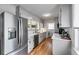 Modern kitchen with stainless steel appliances, white cabinets, and ample counter space at 1083 Amelia Sw Dr, Marietta, GA 30060
