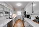 Bright kitchen with white cabinets, stainless steel appliances, and hardwood floors at 1083 Amelia Sw Dr, Marietta, GA 30060