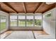 Inviting sunroom featuring wood-paneled ceiling, hardwood floors, and plenty of natural light at 1083 Amelia Sw Dr, Marietta, GA 30060