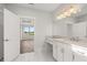 Bathroom features an ensuite vanity, a walk-in shower, and an abundance of natural light at 1629 Tielman Way, Snellville, GA 30078
