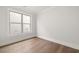 Bedroom with hardwood floor and large window at 1629 Tielman Way, Snellville, GA 30078