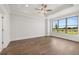 Bright bedroom with large windows offering scenic views and wood flooring at 1629 Tielman Way, Snellville, GA 30078