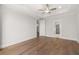 Bedroom with trey ceilings, wood flooring, and ensuite bath at 1629 Tielman Way, Snellville, GA 30078