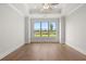 Bright bedroom with large windows offering scenic views and wood flooring at 1629 Tielman Way, Snellville, GA 30078