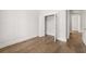 Bedroom with hardwood flooring and an open closet at 1629 Tielman Way, Snellville, GA 30078