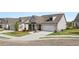 Beautiful home with a two-car garage and landscaped front yard provides great curb appeal at 1629 Tielman Way, Snellville, GA 30078