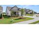 Inviting one-story home with an attached two-car garage and a well-kept lawn in a Gathering-friendly neighborhood at 1629 Tielman Way, Snellville, GA 30078