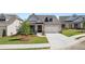 Charming single-story home features brick accents, a two-car garage, and a well-manicured lawn at 1629 Tielman Way, Snellville, GA 30078