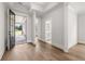 Bright foyer with hardwood floors and neutral walls creates a clean and modern look at 1629 Tielman Way, Snellville, GA 30078
