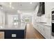 Modern kitchen with granite countertops, stainless appliances, and a large island at 1629 Tielman Way, Snellville, GA 30078