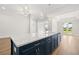 The kitchen has an island with a granite countertop and a stainless steel dishwasher at 1629 Tielman Way, Snellville, GA 30078