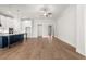 Open-concept living area featuring hardwood floors, a modern kitchen with stainless steel appliances, and bright natural light at 1629 Tielman Way, Snellville, GA 30078