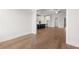 Open-concept living room with hardwood floors, leading into the kitchen at 1629 Tielman Way, Snellville, GA 30078