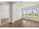 Bright home office with hardwood floors and three large windows overlooking the yard at 1629 Tielman Way, Snellville, GA 30078
