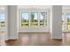Bright home office with hardwood floors and three large windows overlooking the yard at 1629 Tielman Way, Snellville, GA 30078