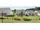 Rear exterior home view with green lawn at 1629 Tielman Way, Snellville, GA 30078