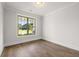 Unfurnished room with hardwood floors and a large window at 1629 Tielman Way, Snellville, GA 30078