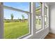Bright sunroom with hardwood floors and three large windows overlooking the backyard at 1629 Tielman Way, Snellville, GA 30078