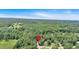 Aerial view of property nestled among lush trees, marked by a house icon at 328 West Ln, Woodstock, GA 30188