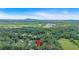 Aerial view of property marked by a house icon, set amongst lush green trees at 328 West Ln, Woodstock, GA 30188