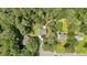 Aerial view of property showcasing lush green trees and the neighborhood layout at 328 West Ln, Woodstock, GA 30188