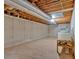Unfinished basement with concrete walls and exposed utilities, offering potential for customization at 328 West Ln, Woodstock, GA 30188