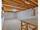 Unfinished basement with concrete walls, and open ceilings showing utilities, offering ample space at 328 West Ln, Woodstock, GA 30188